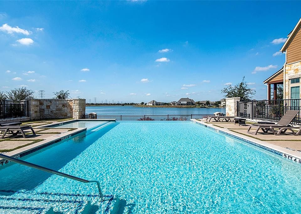 Enjoy the Towne Lake lifestyle, live like you are on Vacation every day! Sunsets are spectacular from the infinity edge Pool in Lakeshore at Towne Lake.