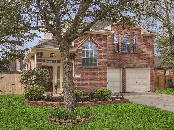 Another view of the front of thee home. Note: the manicured lawn and new fence on both sides of the home.