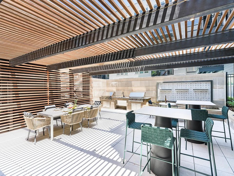 Gather under the slatted shade for casual cookouts or weekend brunches_perfect for connecting with neighbors or entertaining friends in style.