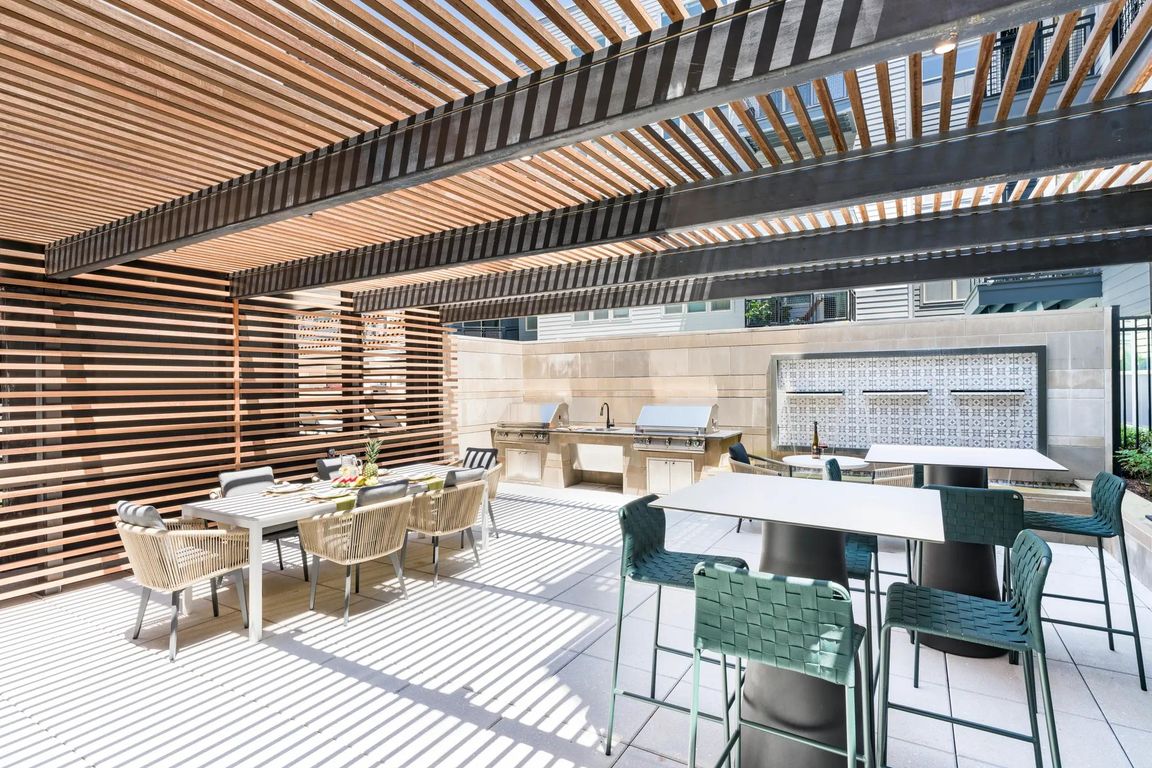 Gather under the slatted shade for casual cookouts or weekend brunches_perfect for connecting with neighbors or entertaining friends in style.