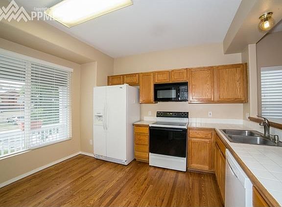 Large Kitchen w/ real hardwood flooring.