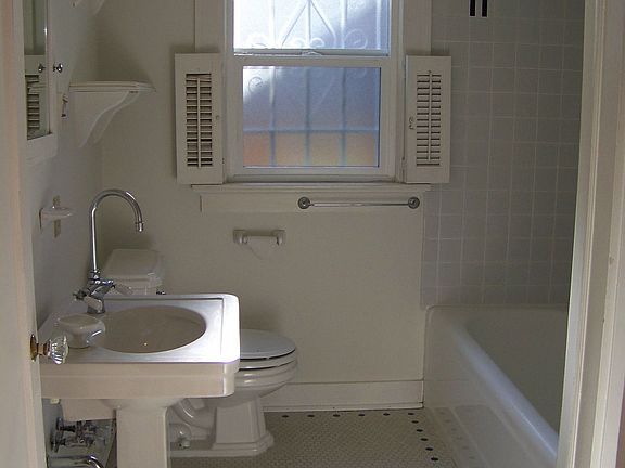 Main floor bath with tile mosaic floors