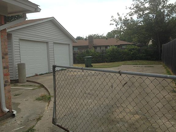 additional 2 car garage/shop in the back of the house. Electricity, shelving, lighting