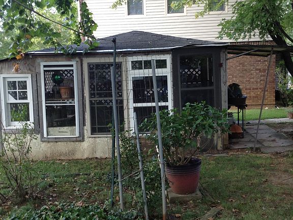 Greenhouse with sitting area