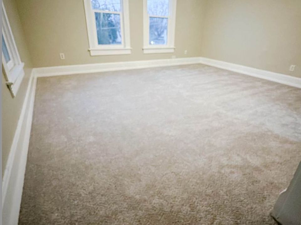 Large front living room with windows