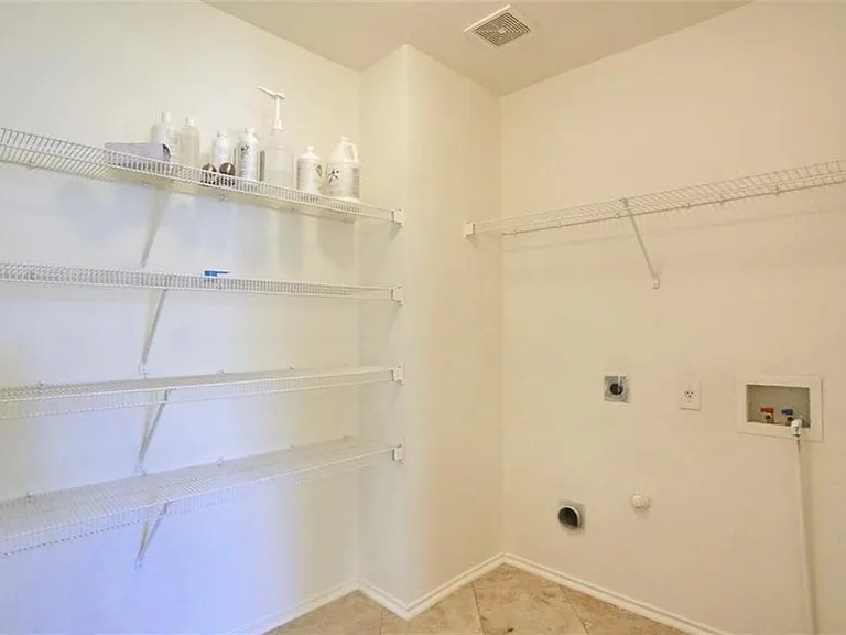 Laundry room with space for full size washer and dryer