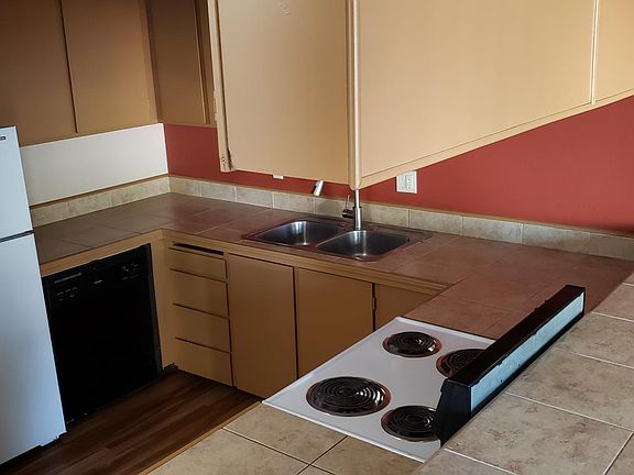 Large open kitchen gets lots of light from big window in the huge dining room.