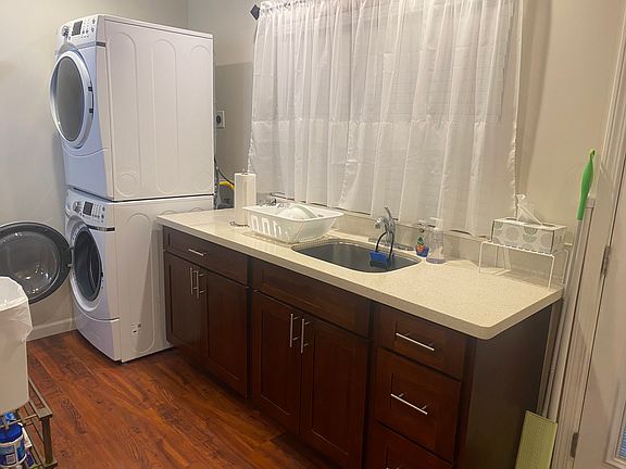 Sink w/garbage disposal. Washer and gas dryer on the left.
