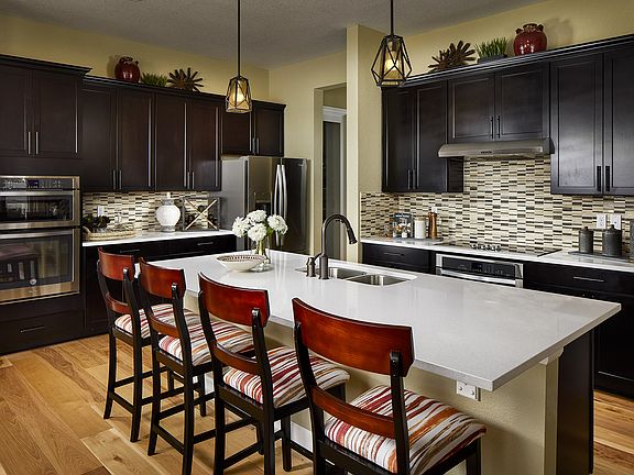 A gorgeous kitchen with an over-sized island perfect for breakfast or entertaining.