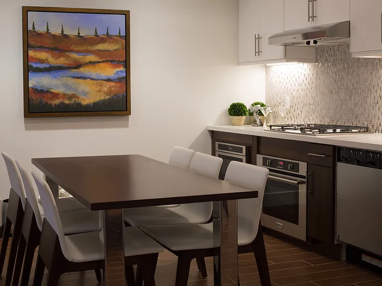 Resident clubroom with dining and kitchen area