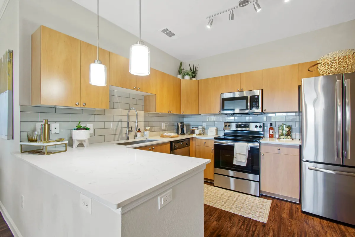 Model Kitchen | Backsplash | Stainless Steel Appliances - Mission Hills Apartments