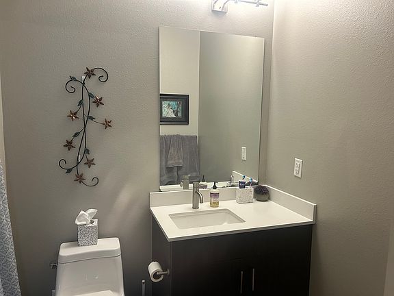 Private bathroom with tub shower combination.