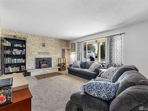 A fireplace insert provides a great source of heat, supplementing the heat pump mini split system.