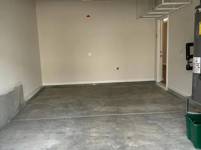 Single car garage with additional storage rack
