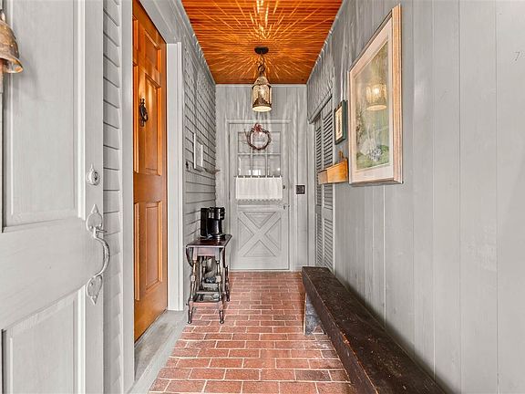 HALLWAY FROM 4 SEASONS ROOM TO KITCHEN AND EXTERIOR