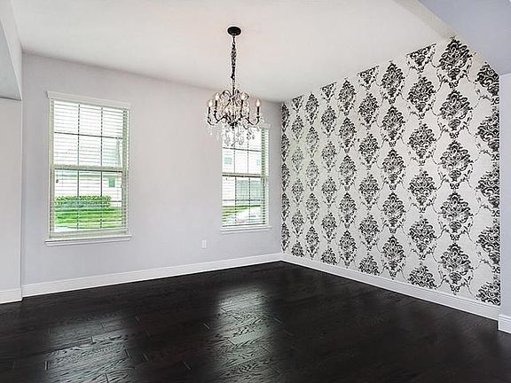 Formal dining room with feature wall