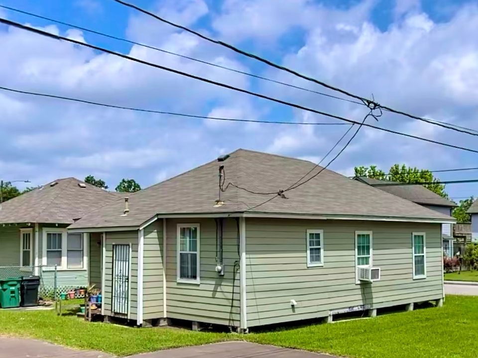Rear view of Home with Parking spot off street.