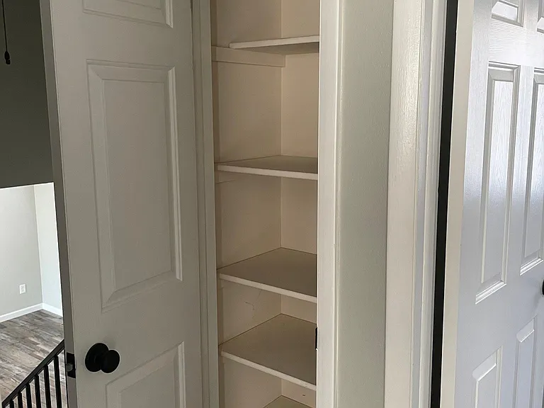 Linen closet next to Bedroom 2