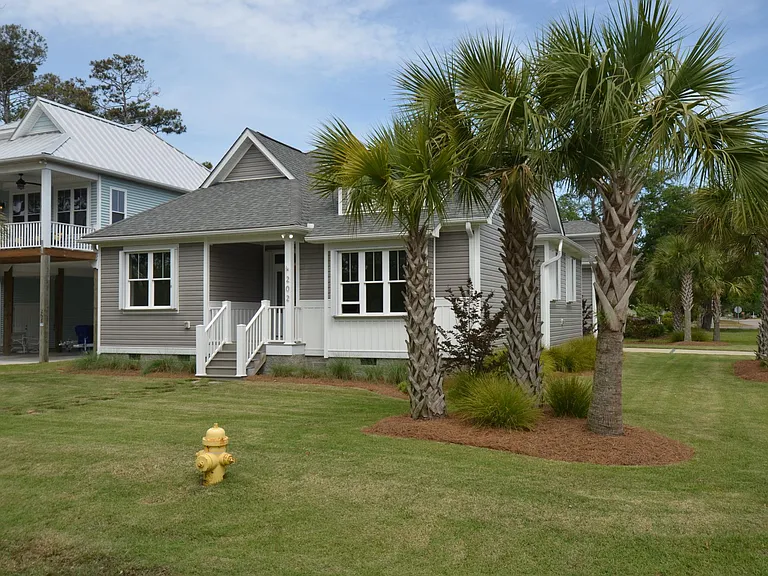 Corner lot with mature palms and manicured landscaping
