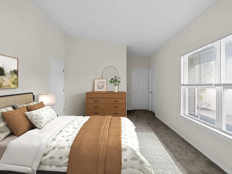 Welcome to Mansions at Delmar, an Eagle Rock Community, where modern design meets comfort. This inviting bedroom features natural light, stylish furnishings, and ample space for relaxation. Schedule a tour today and see your future home!