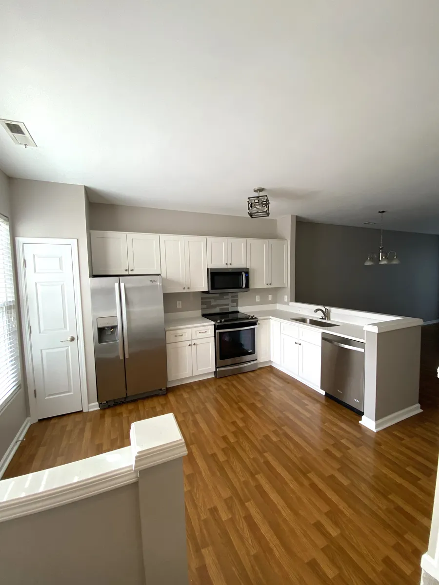 Kitchen and dining area behind half-wall - 1743 Sorrell Brook Way