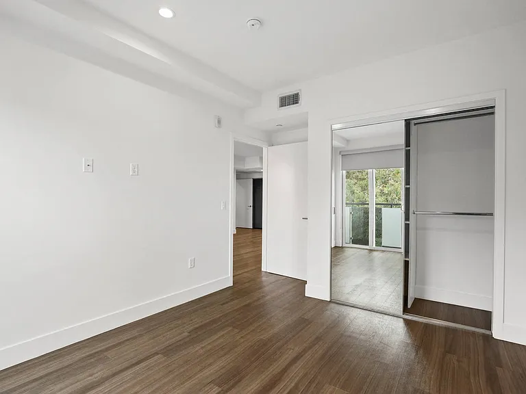 Bedroom with Mirrored Closet