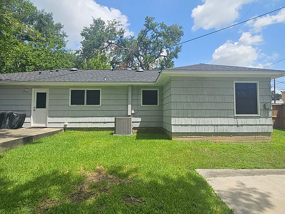 Rear of home with new solar shades installed.