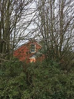 Side of the house, shows upstairs bedroom