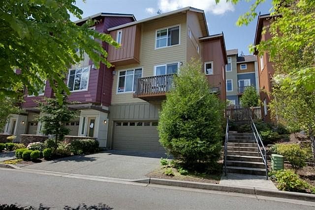 End unit with 2 car garage plus large driveway