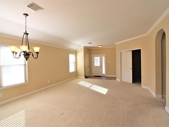 Living -Dinning combo looking at entrance and study. (All carpet to be replaced by tile soon)