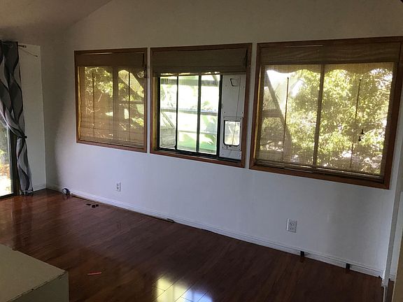 Bedroom with pet door leading out into secured open-air cat patio (the catio!)