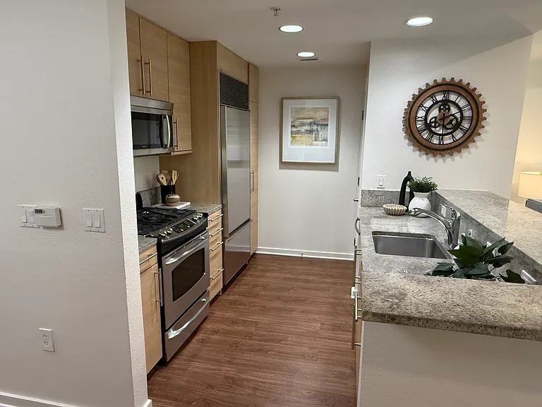 A fully equipped kitchen featuring premium appliances, including a state-of-the-art Sub-Zero refrigerator.