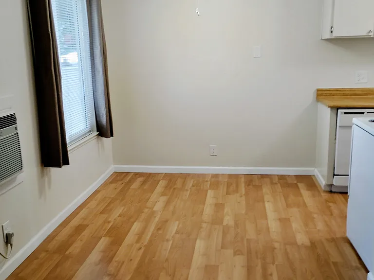 Dining Area includes window coverings with single wall Airconditioner