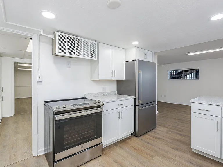 New stainless steel appliances in kitchen.