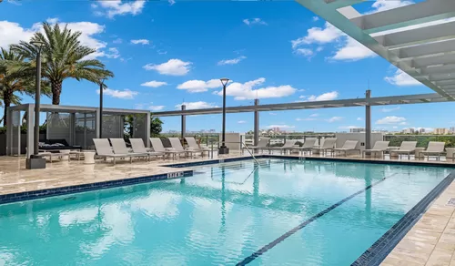 Take a dip at your rooftop pool with beautiful views - The District at Flagler Village
