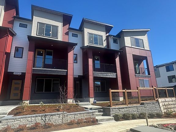 The Entry to the townhome is on the West side of the building. With a covered view balcony off the main living areas