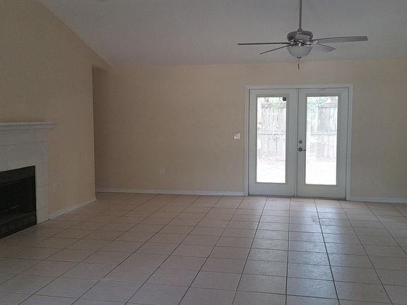 Great Room, hallway to half bath and kitchen
