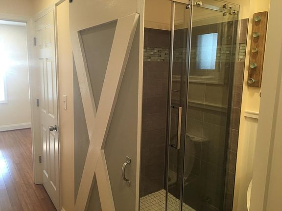 Barn door entry to bathroom