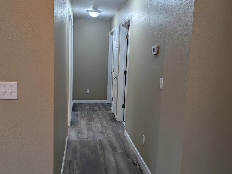 Hall from living room to 3 bedrooms