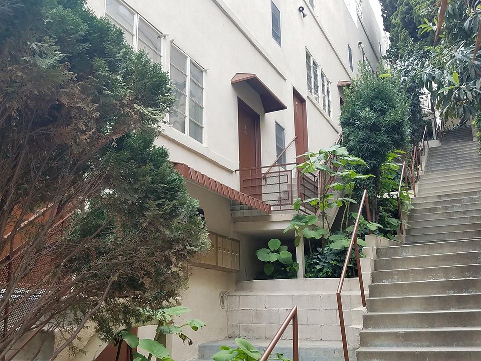 From just inside the front gate look up towards the apartmen