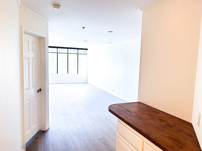 Main living area from bar area and hallway