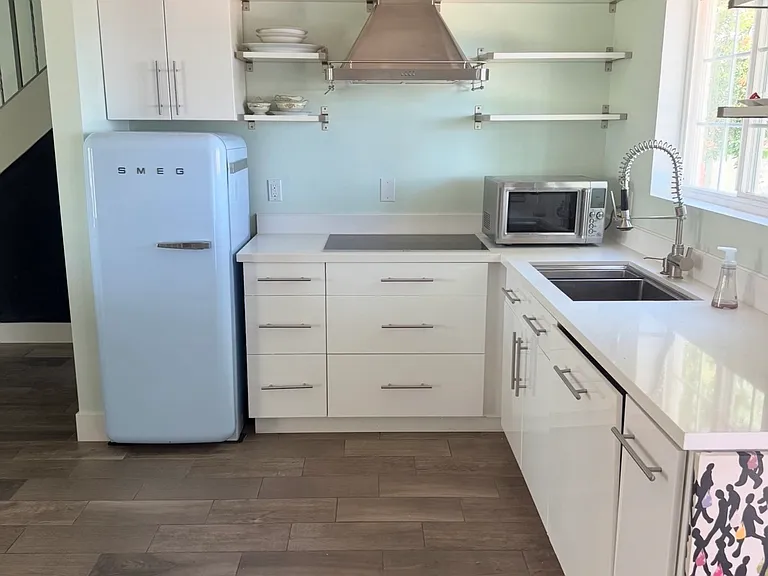 Kitchen with retro SMEG Fridge.