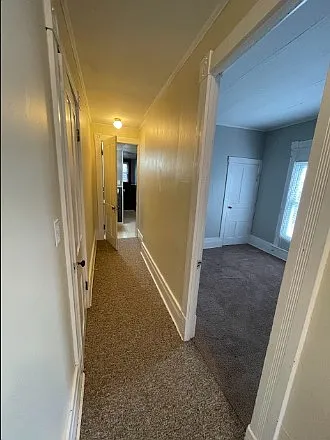 Upstairs hallway. There is a closet on the left
