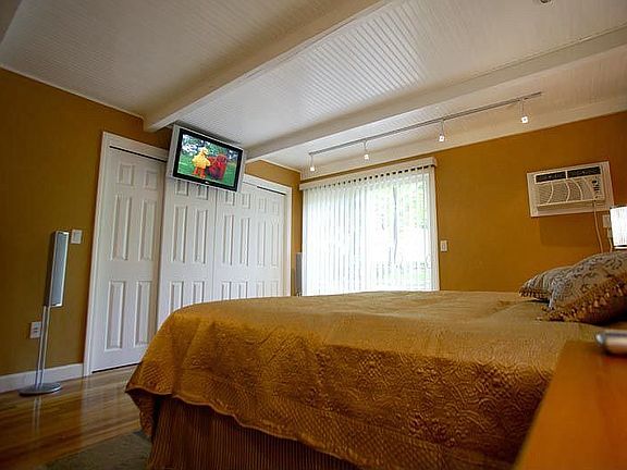 master bedroom with SurroundSound, sliders to great private deck