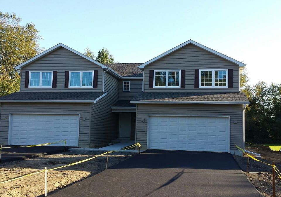 FRONT EXTERIOR (UNIT NOW HAS GRASS)