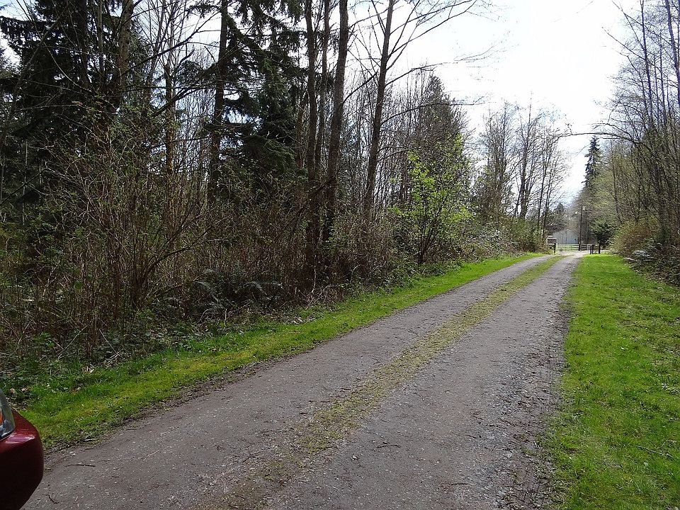 1st image of 9070 NE Country Woods Ln