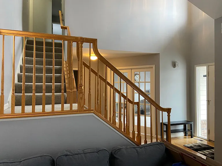 Cathedral ceilings in the entrance lead to open concept family room, dining room and kitchen. French doors lead to 1st floor office.