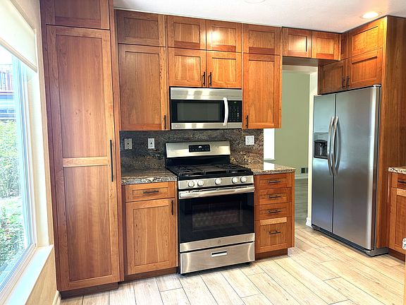 Gas stove, microwave, granite counter tops, new cabinets