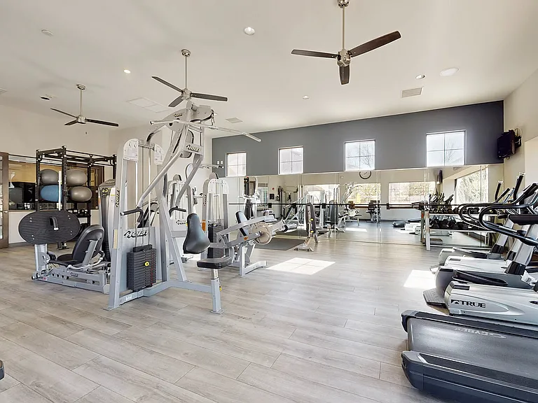 Elevate your fitness routine in this contemporary gym filled with top-of-the-line equipment.