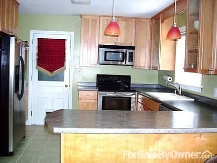 Kitchen
						:
						Kitchen seen from family room , door to garage in rear